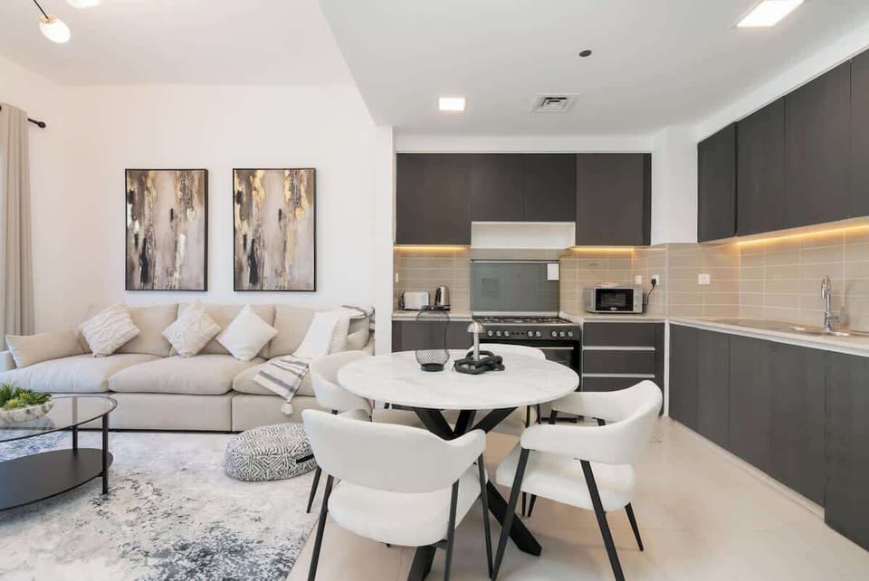 The kitchen with all the appliances you need for making a good delicious meal with small dining table with comfortable chairs. All you need is under one roof.