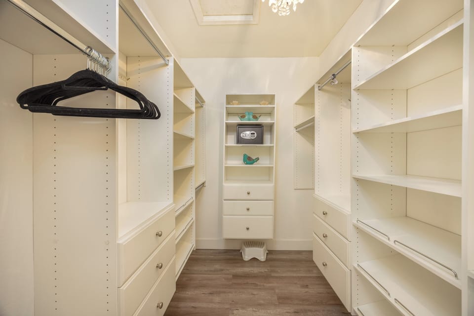Master closet with hangers and safe