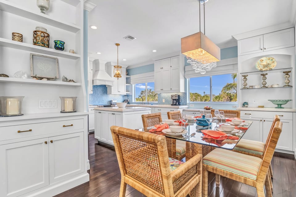 Pull up a chair and enjoy the effortless connection between the dining table and kitchen, designed for easy conversation and shared meals.