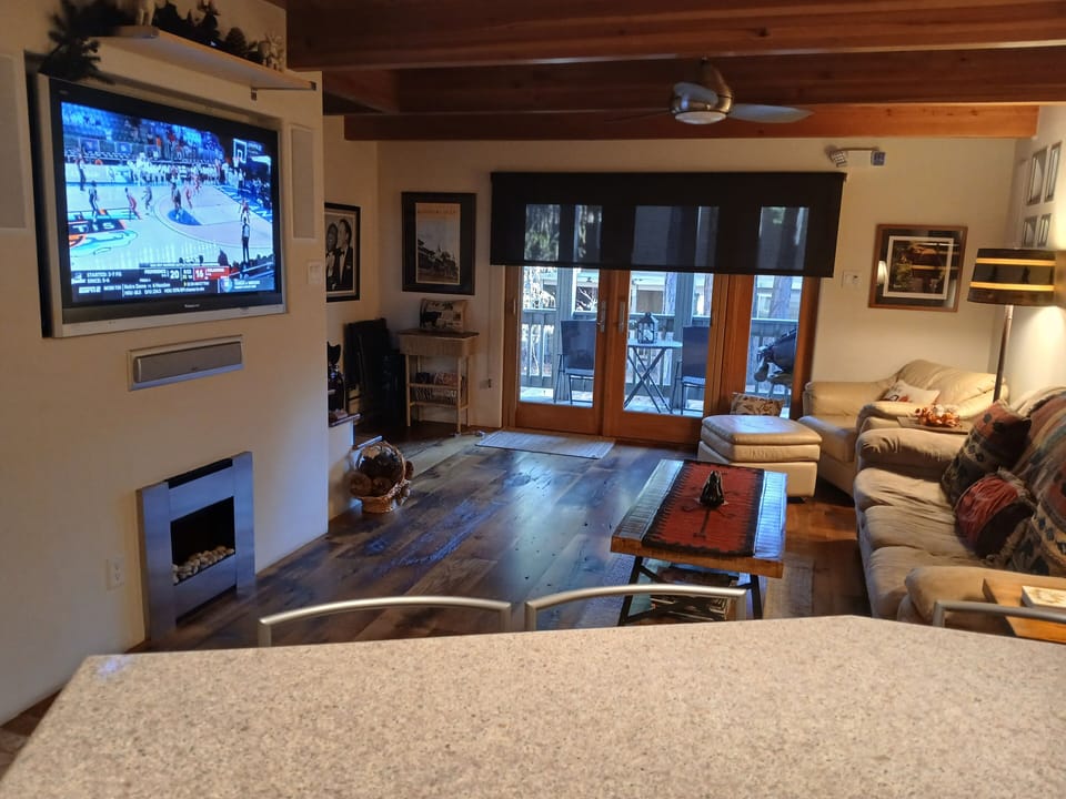 View from kitchen overlooking comfortable-spacious living room space.