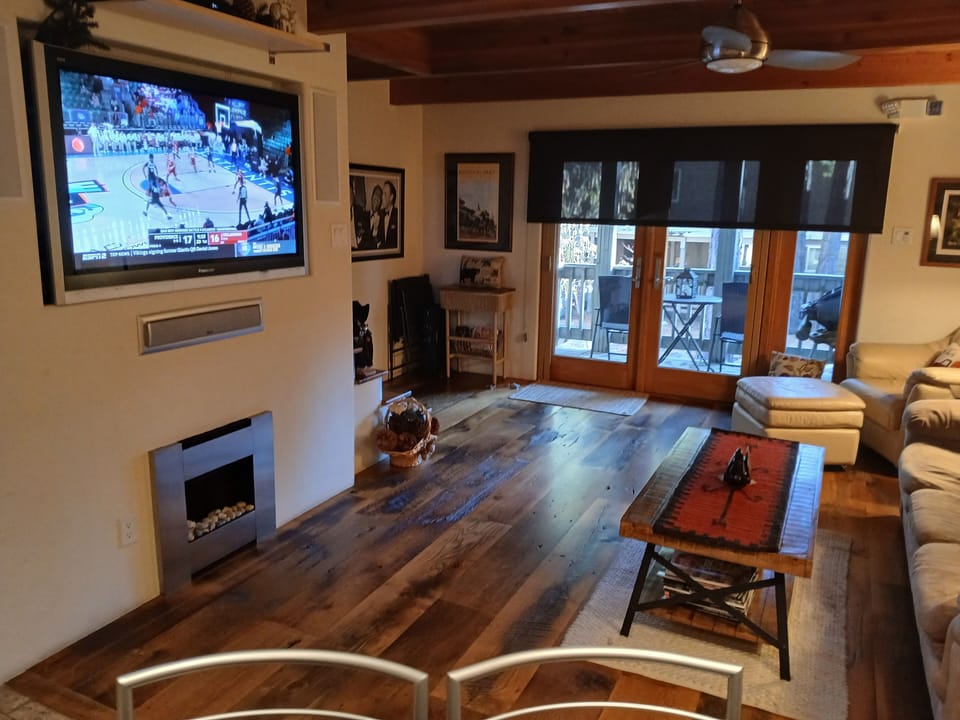Beautiful and polished shine of hardwood floors flowing towards the deck.