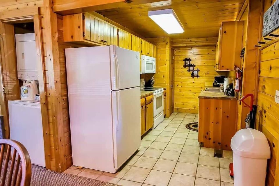 Whip up culinary delights in this charming kitchen with wooden accents and ample space!