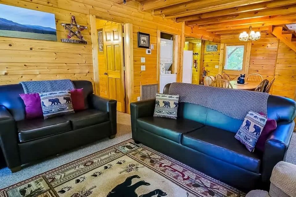  Relax in style with leather seating, wooden accents, and bright, inviting vibes!