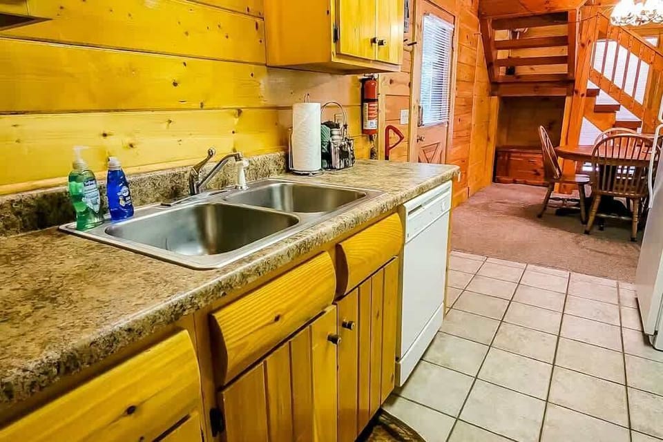 Whip up delicious meals in this charming wooden kitchen with modern amenities!