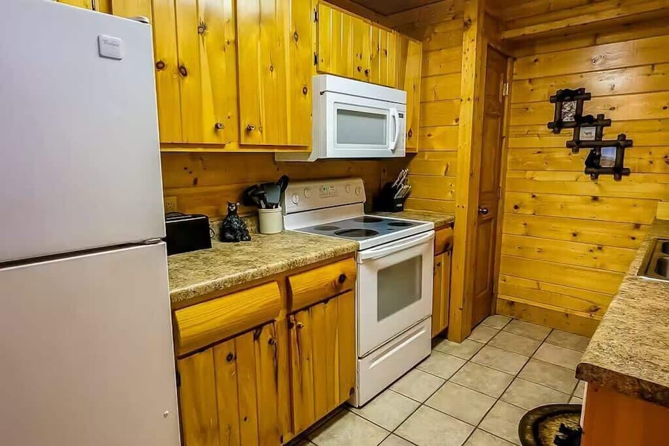  Rustic charm meets modern convenience in this well-equipped, inviting kitchen!