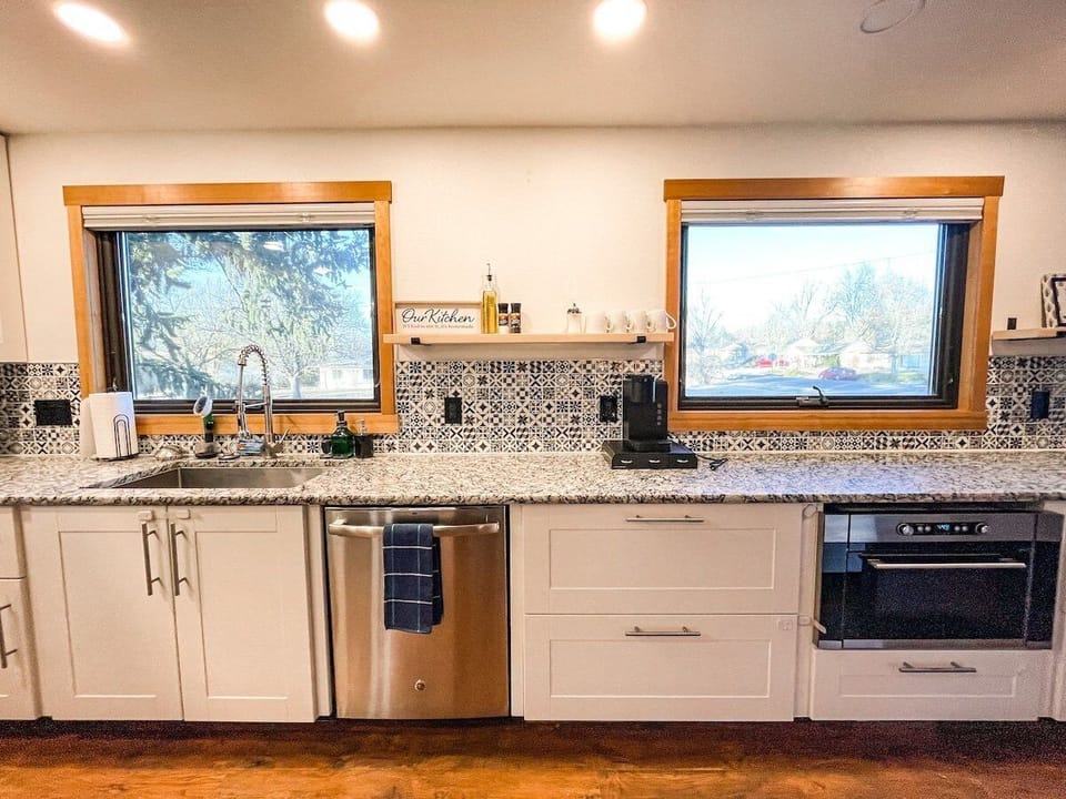 A stocked kitchen with a fridge, microwave, electric range and oven. We also provide the basics such as salt, pepper, cooking oil.