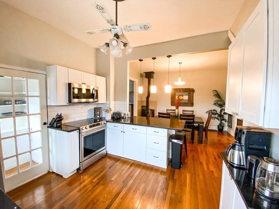 The remodeled kitchen is bright and functional, equipped for everyday cooking and longer stays.