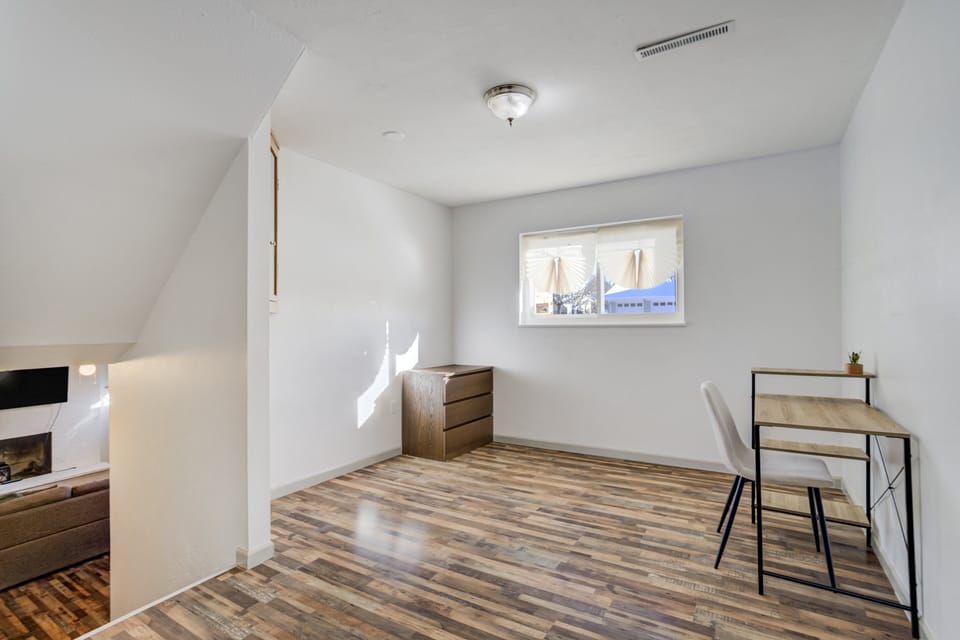 Downstairs, a dedicated workspace offers a quiet area to catch up on some work (note: this area is open, not a closed bedroom and it does not have a door).