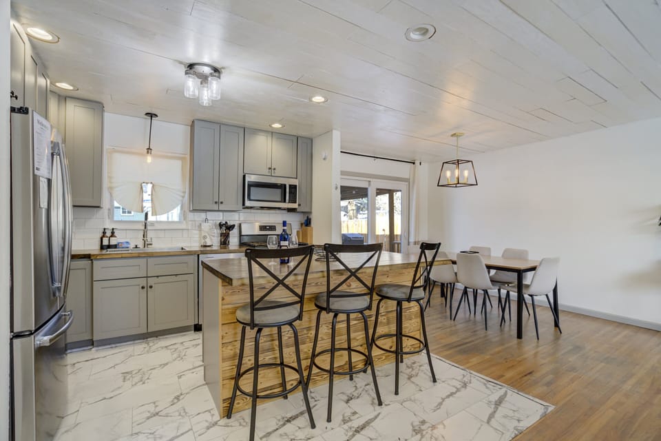 Gather for meals in the dining area with seating for 6 plus 3 at the breakfast bar.
