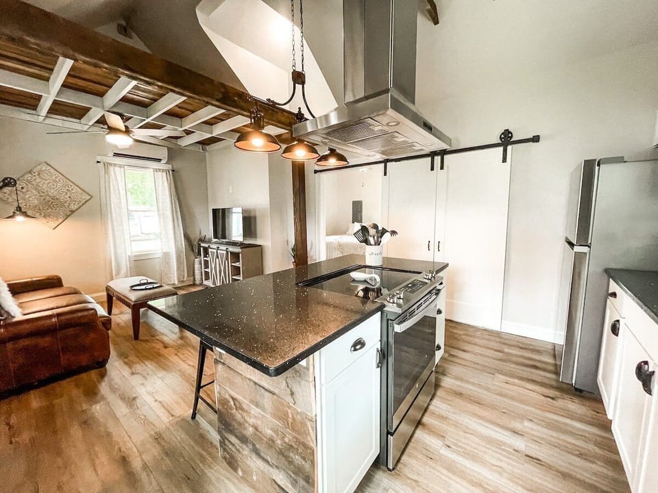 Gourmet kitchen with a fridge, microwave, electric range and oven. We also provide the basics such as salt, pepper, cooking oil.