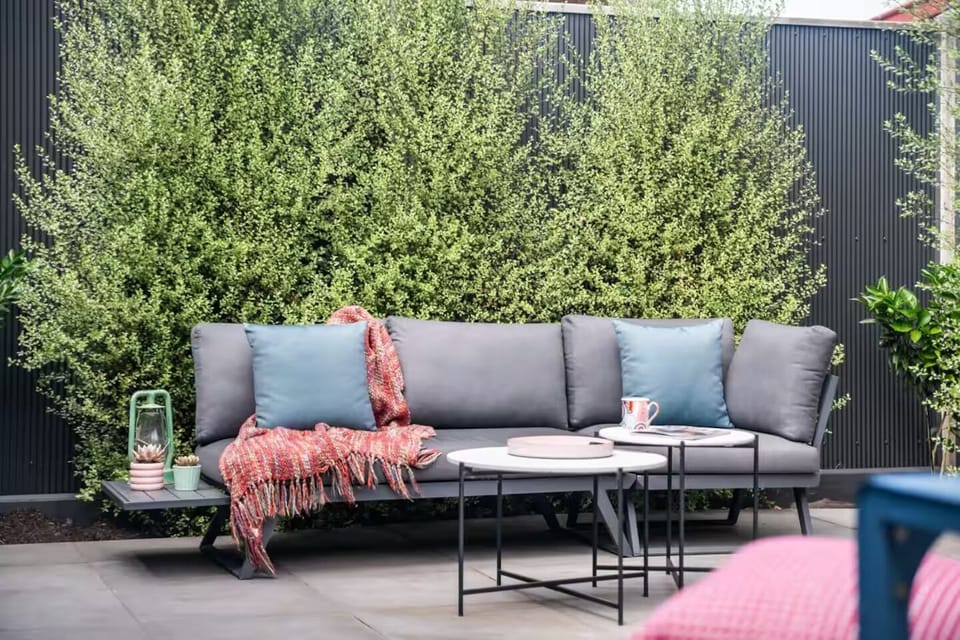OUTDOOR LOUNGE: For relaxing in the sun the sunny rear courtyard has an outdoor lounge setting.