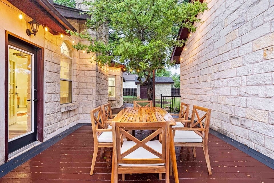 Wine, dine, and unwind: Our enchanting outdoor dining space with stunning string lights is the ideal setting for a relaxing evening in Dripping Springs.