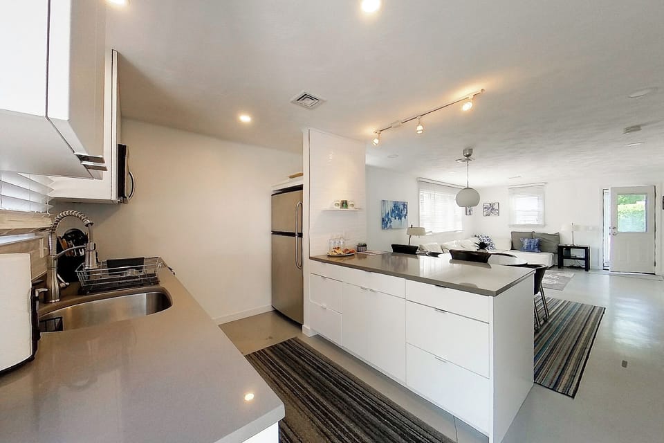 The kitchen offers a breakfast bar with seating for next to the dining table