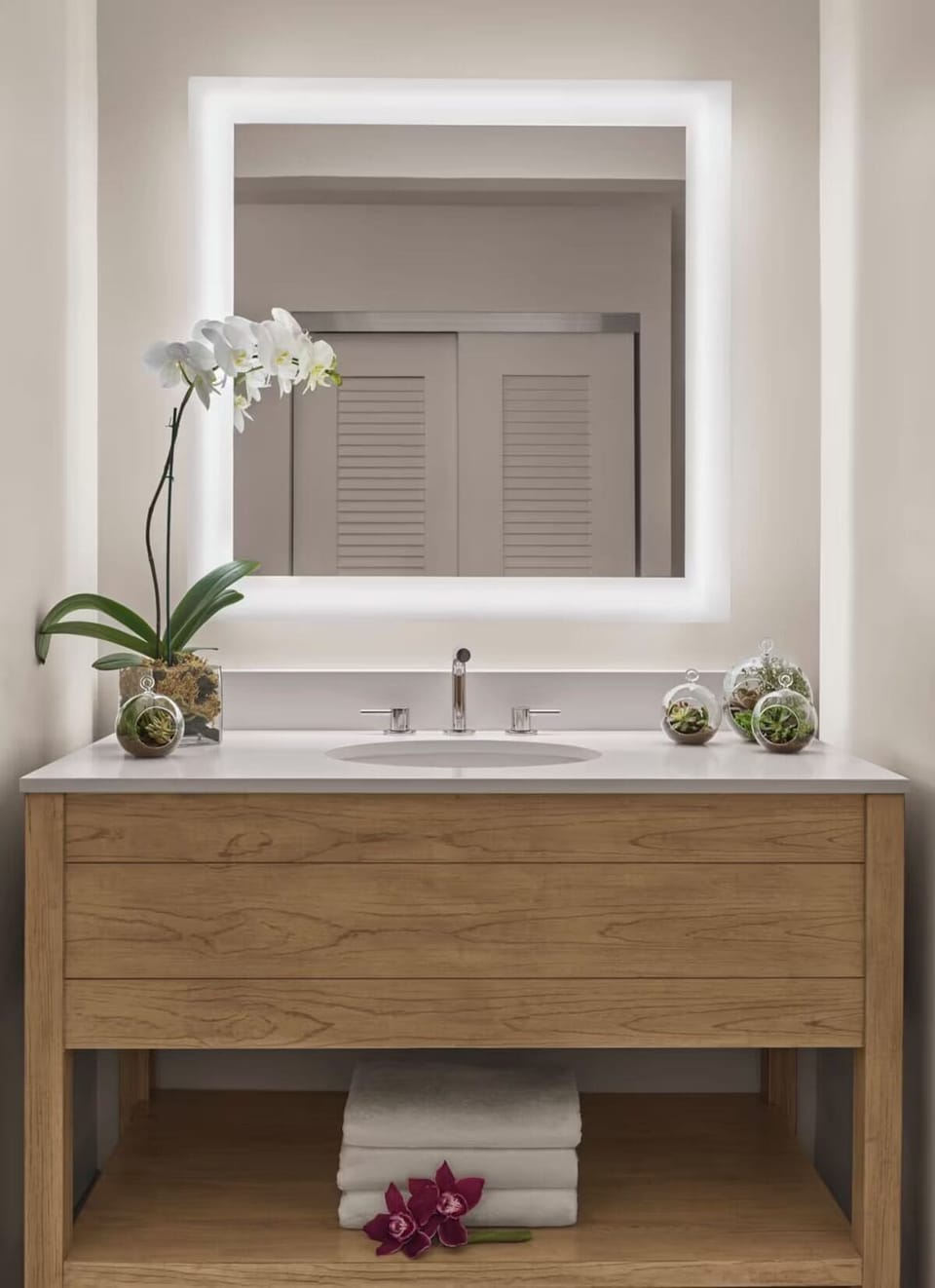Refresh at a spa-like vanity with bright, flattering mirror light.