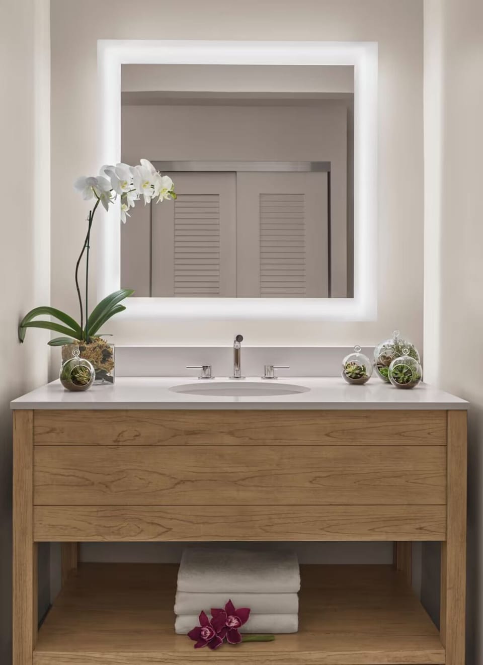 Refresh at a spa-like vanity with bright, flattering mirror light.