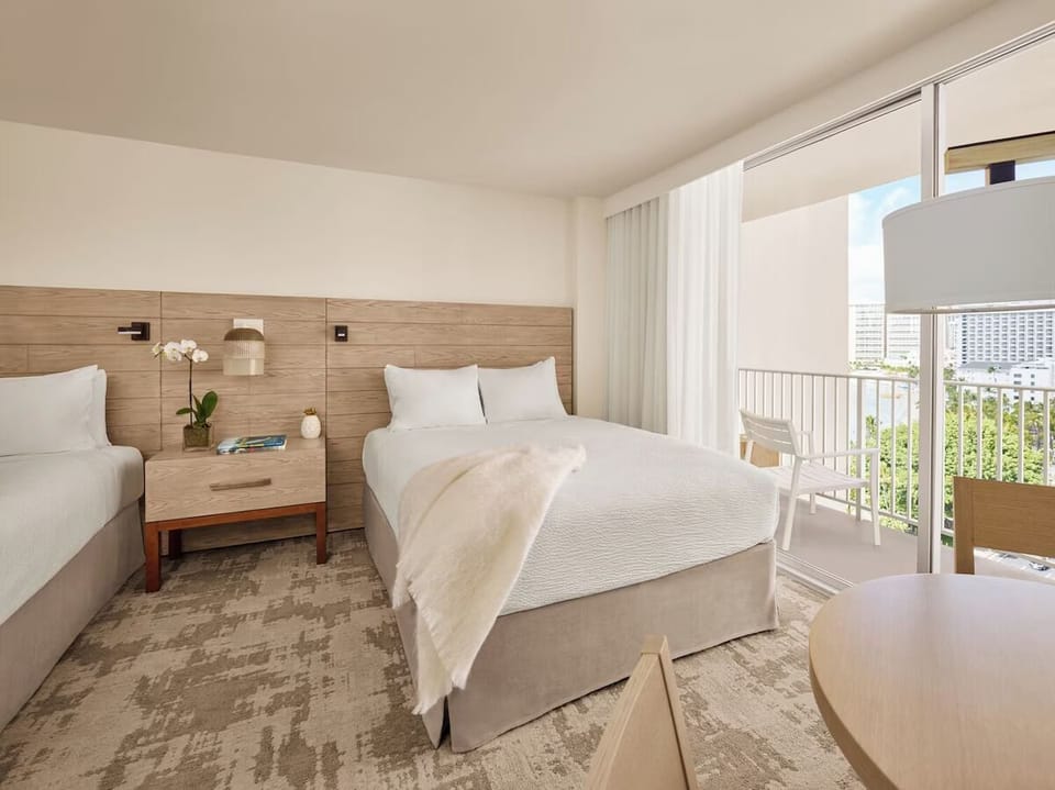 Unwind in a bright corner room with breezy balcony seating