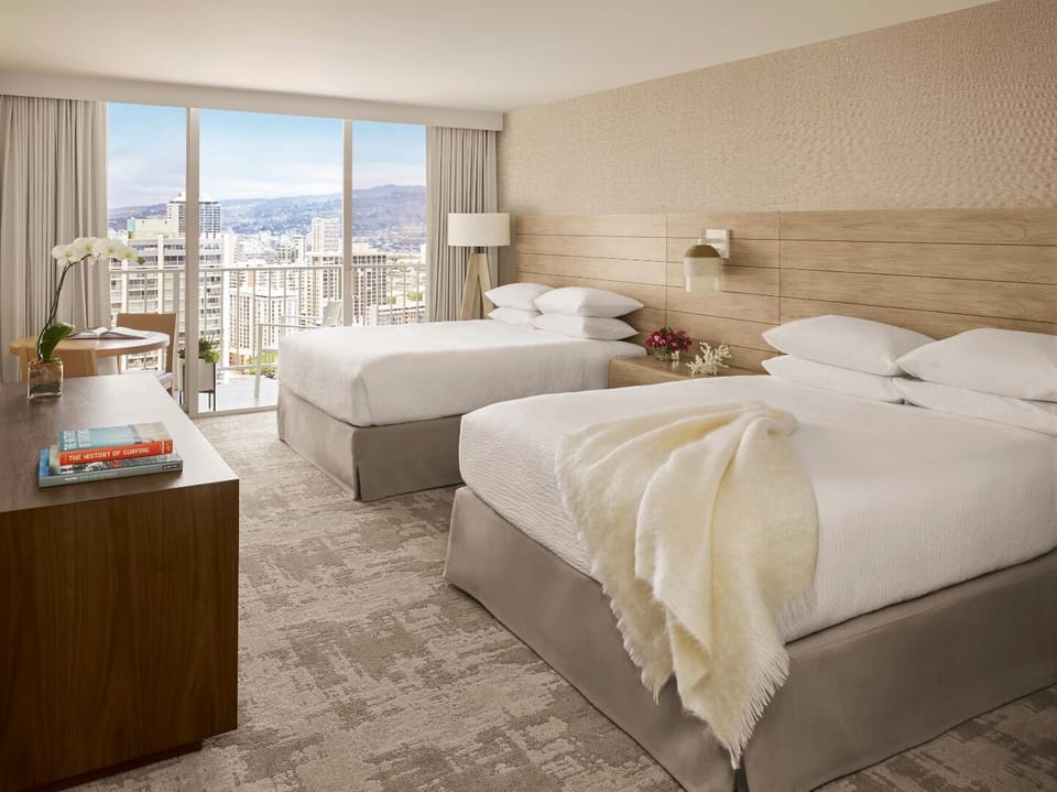Stretch out in plush beds with sweeping skyline views