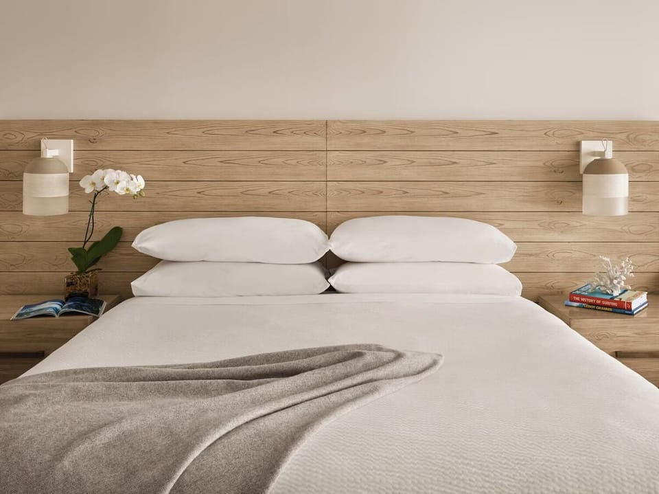 Sink into crisp linens for a deeply restful night’s sleep.