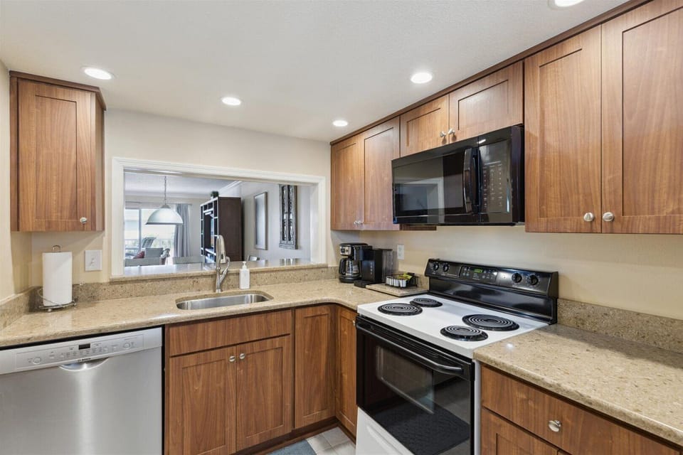 Kitchen with ample cabinetry and appliances.