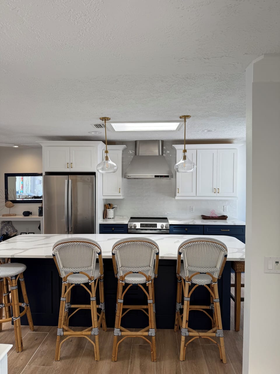 large white & blue kitchen blends coastal style with brand new appliances!