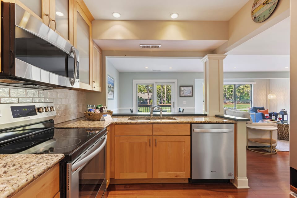 Redesigned kitchen with granite countertops, new cabinets and stainless-steel appliances.