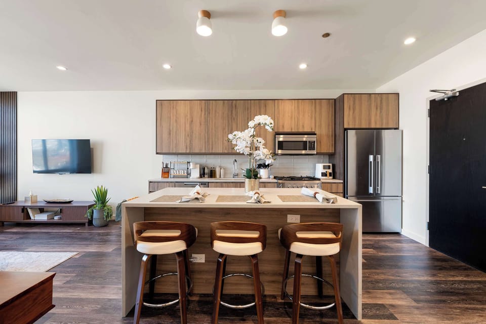 Sleek modern kitchen w/ streamlined cabinetry & a clean, contemporary layout.