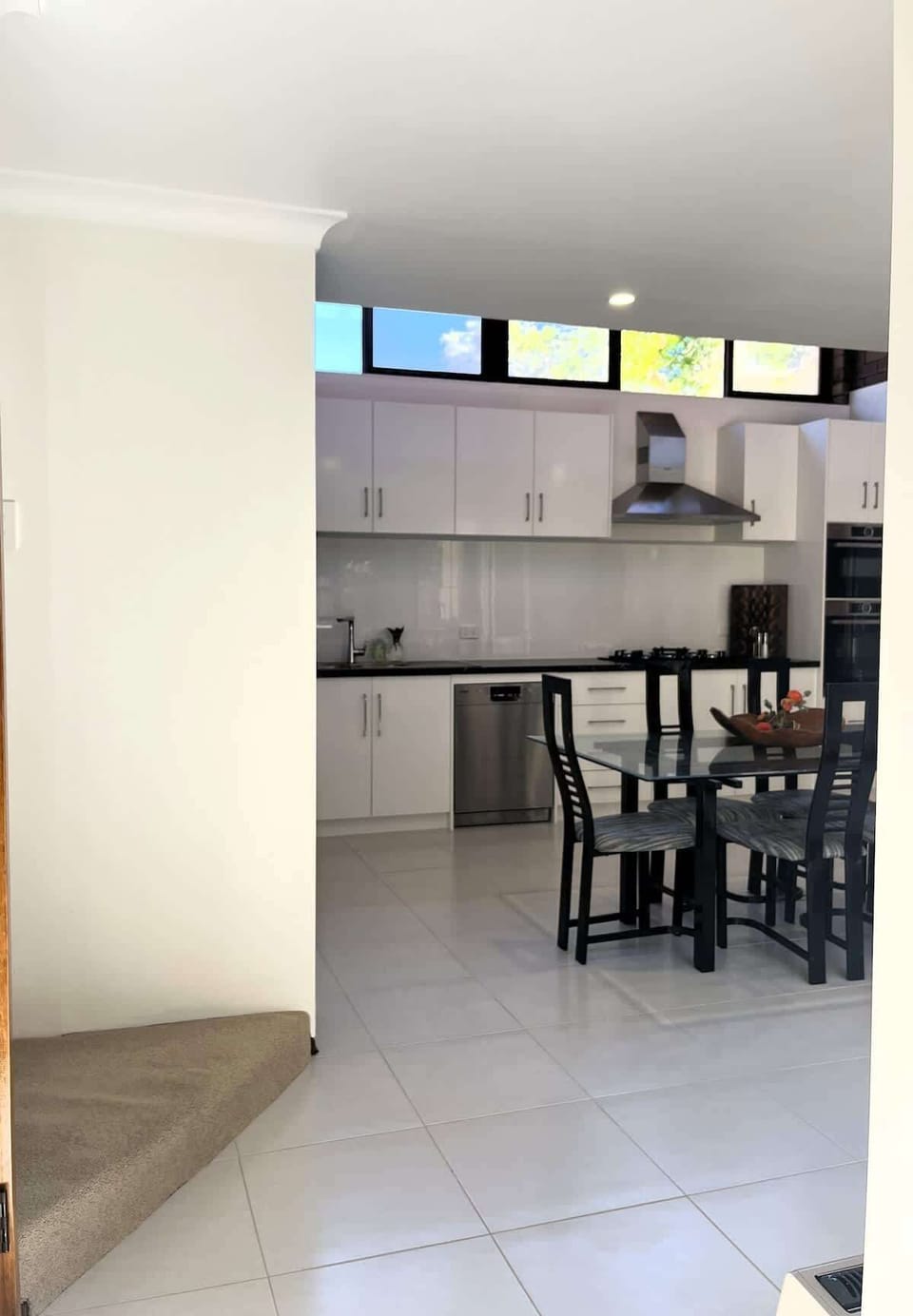 Prepare delicious meals in our well-equipped kitchen, featuring ample cabinet space, a convenient dishwasher, oven, microwave, and sink—everything you need for easy cooking.