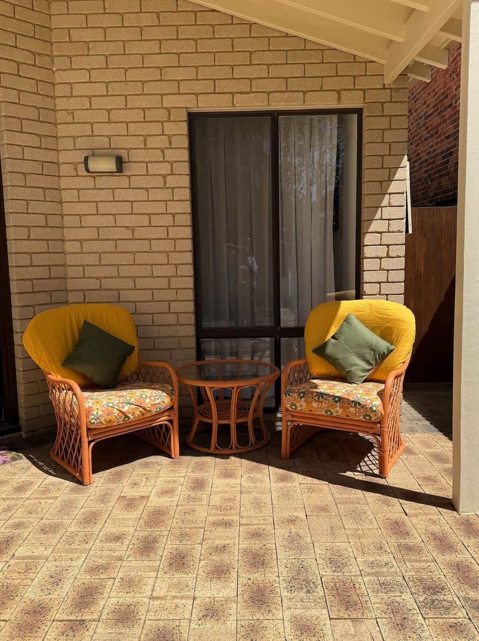 Welcome to your inviting front entrance, offering a comfortable spot to relax outdoors before stepping inside. 