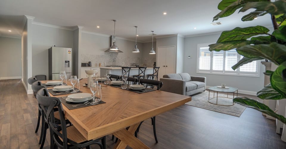 Open plan kitchen and dining with separate living space