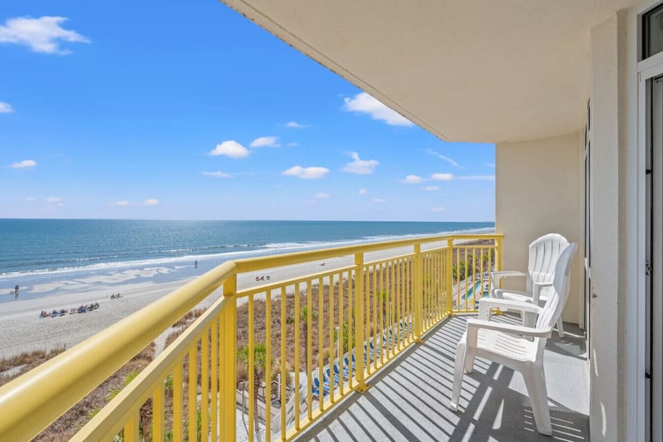 This Bay Watch Resort balcony is located on a low floor int he heart of the resort.  Experience resort, oceanfront, and beachfront views as you relax on this amazing condo`s balcony.