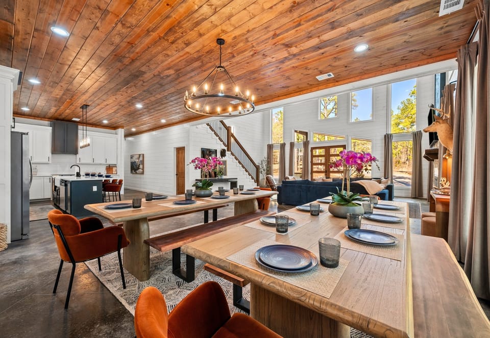 The spacious dining area is set for memorable meals, with a stylish setup that makes every dinner feel special.