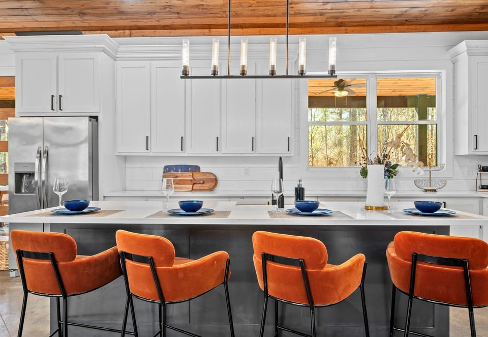 Comfortable bar seating at the island makes it easy to chat with the chef while enjoying your morning coffee or a late-night snack.