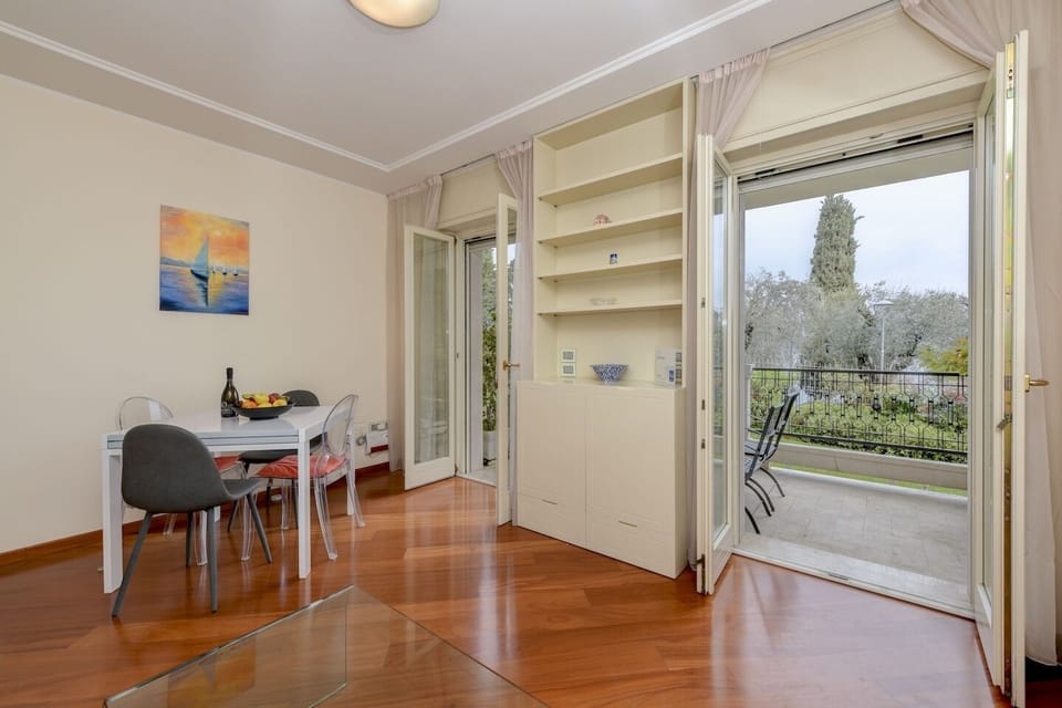 Living room with exit to balcony with lake view