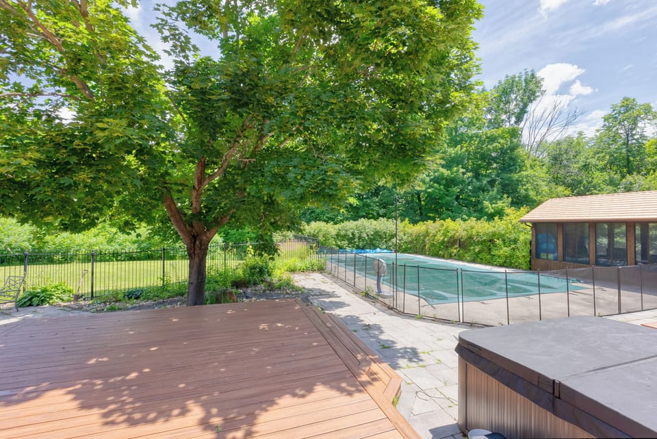 The backyard offers a peaceful, nature-filled escape with a Fenced Swimming pool