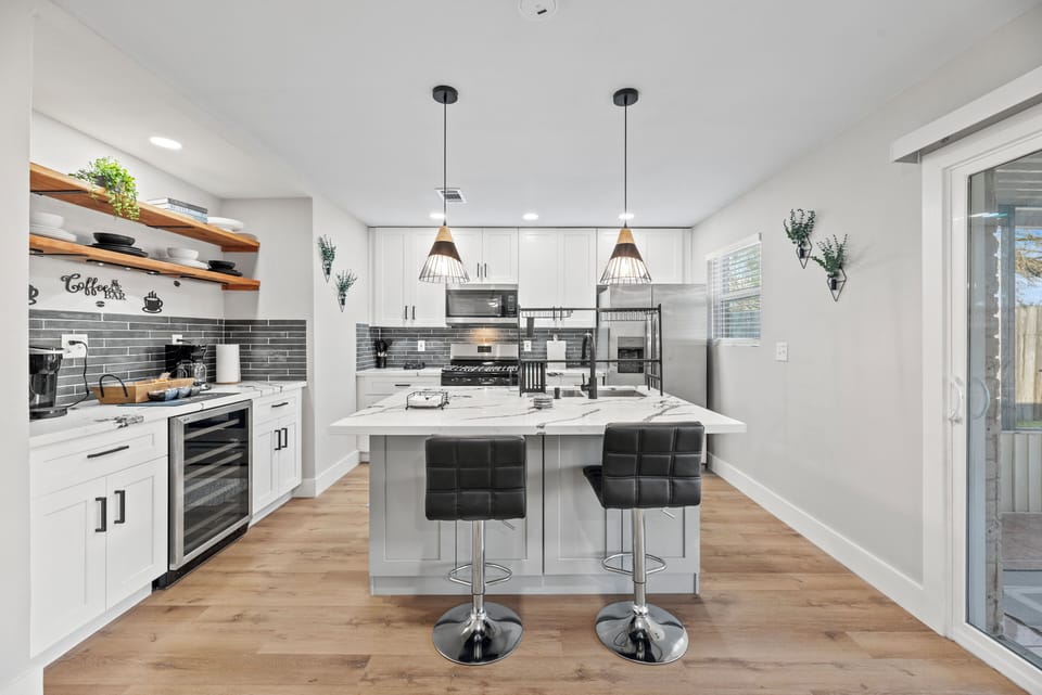 A fully equipped kitchen w/ stainless steel appliances - perfect for cooking.