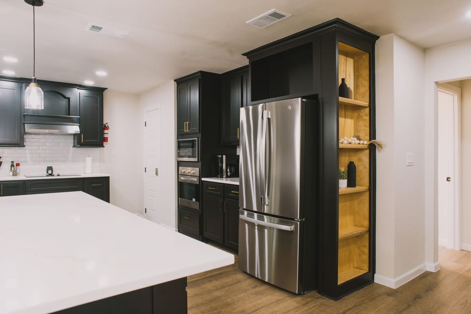 Discover the full scope of this beautifully appointed modern kitchen, complete with premium appliances ready for your culinary adventures.