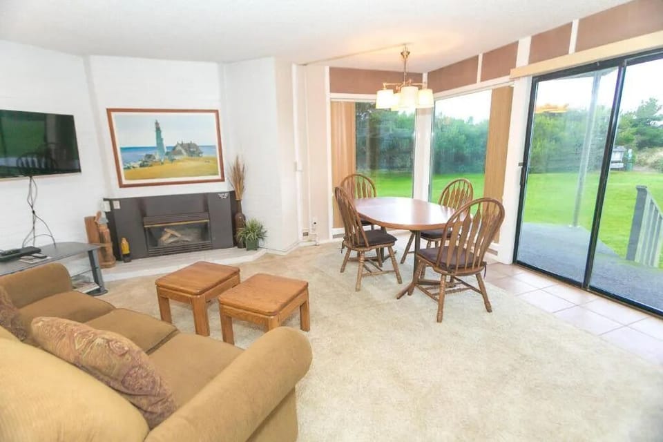 Gather by the fireplace, then step out to the patio.