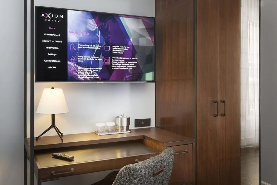 Work comfortably at the sleek desk with in-room entertainment.