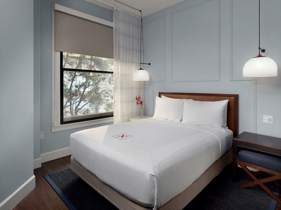 Wake up to soft daylight in a calm, airy room.
