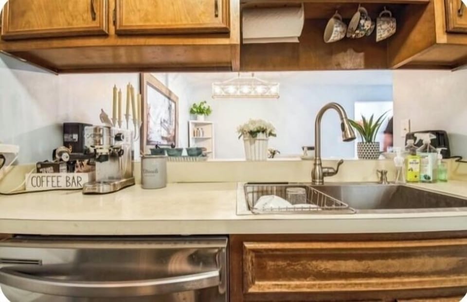 Kitchen with a lot dishes, coffee cups & pots