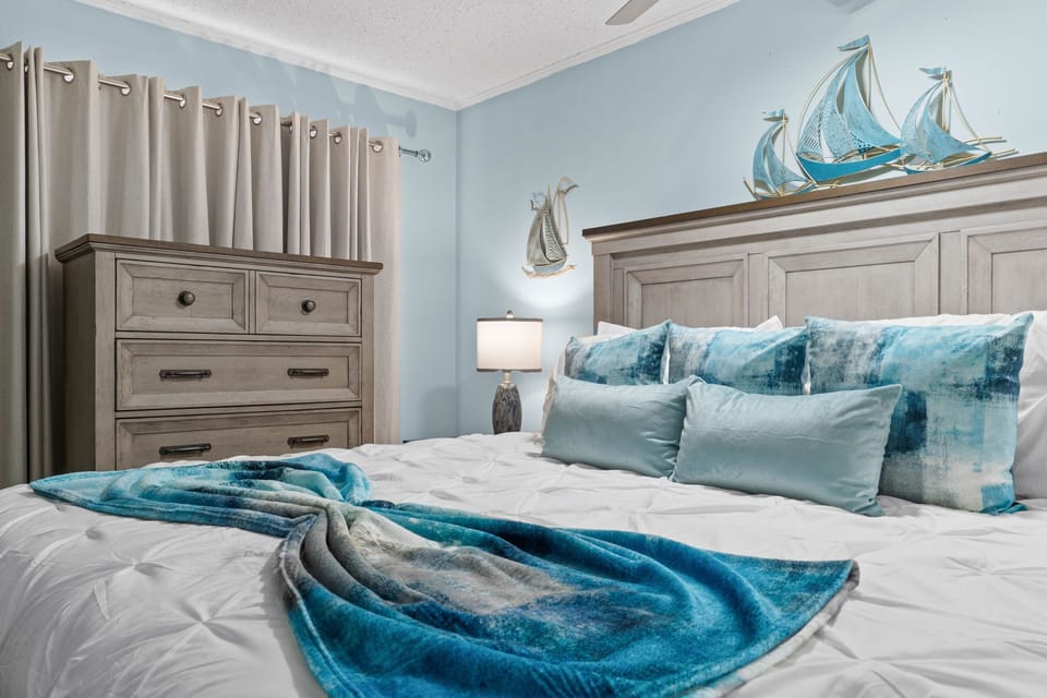 Your coastal retreat isn't complete without a peaceful night's sleep in this spacious master bedroom.