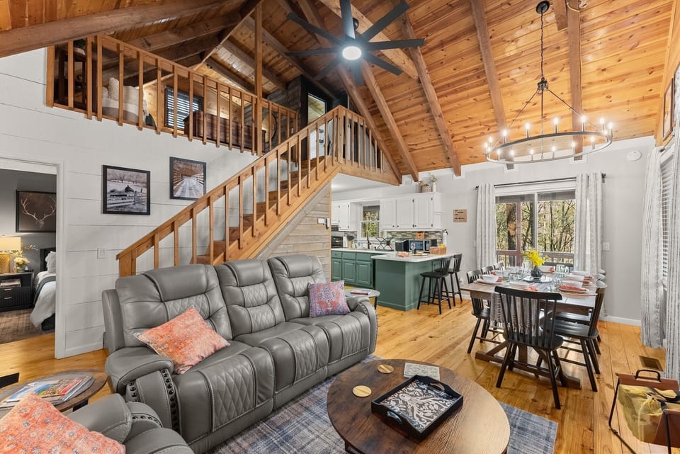 Recline, reconnect, or binge-watch beneath soaring ceilings and warm wood beams