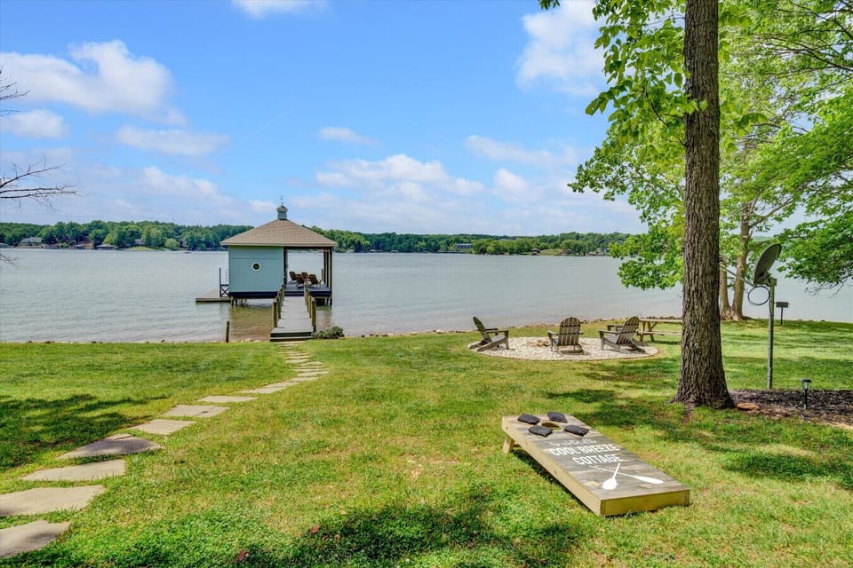 Inviting front lawn with panoramic lake views.