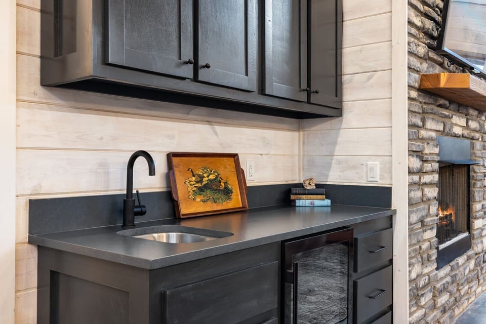 Small kitchen area by fireplace by living area