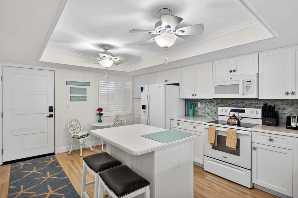 Kitchen with island and bar seating