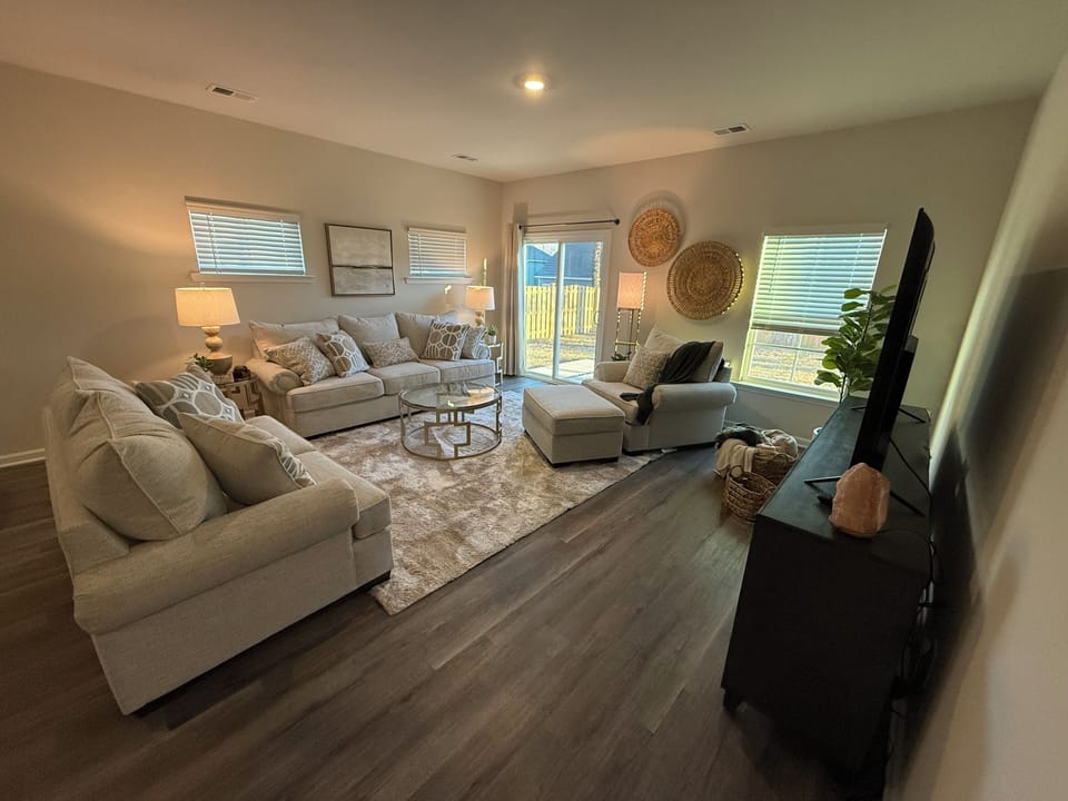 Enjoy family gatherings in a spacious living room with a queen sofa bed