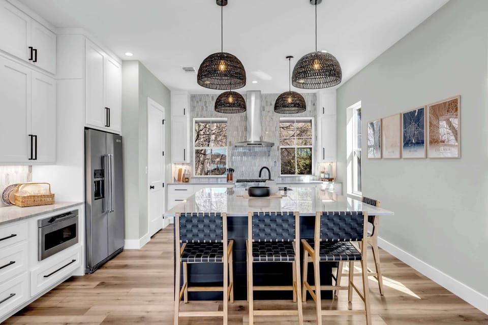 Kitchen has additional seating at the island