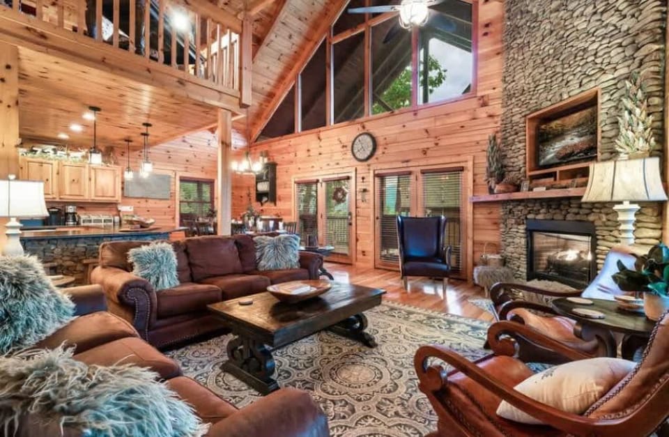 Step into comfort! Our living room boasts high vaulted ceilings and a warm, inviting space to unwind.