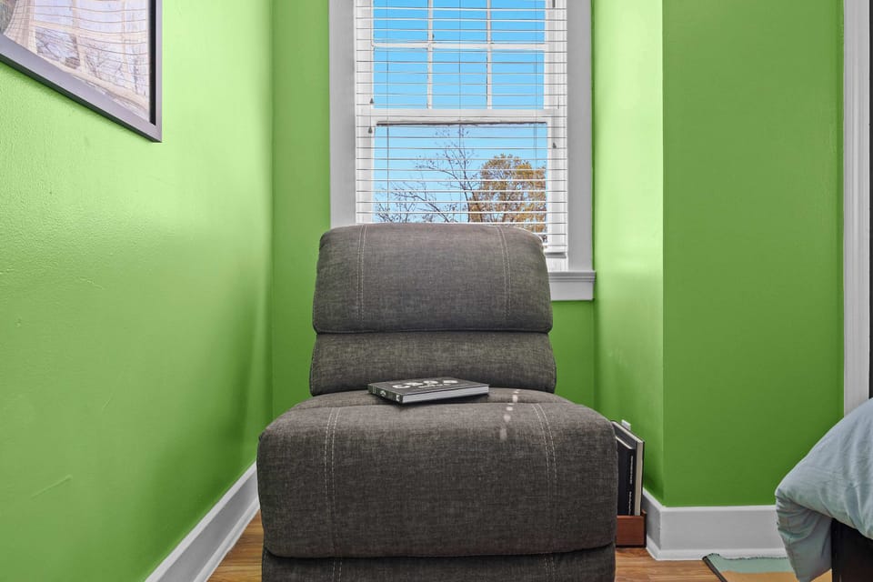 Bedroom 2: Drift off in this cozy, sunlit bedroom designed for restful nights.