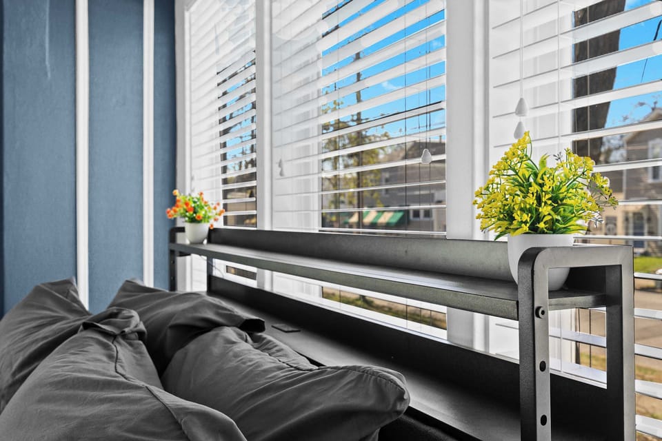 Bedroom 1: Comfortable and spacious bedroom with soft linens and natural light.